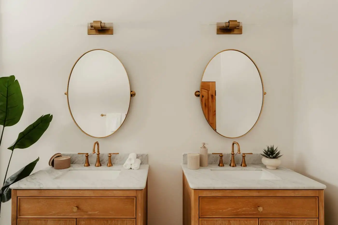 Floating timber vanity with twin basins and round mirrors